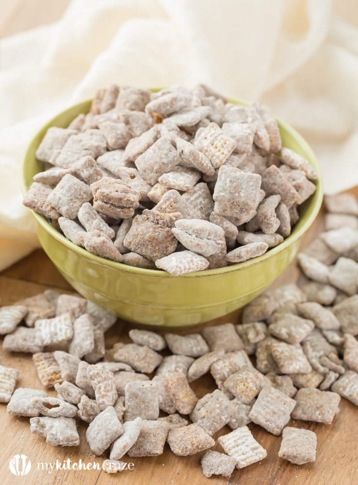 Muddy Buddies ~ crunchy cereal coated with chocolate, peanut butter and powered sugar. This is one kid approved snack and the best news is it takes minutes to throw together!