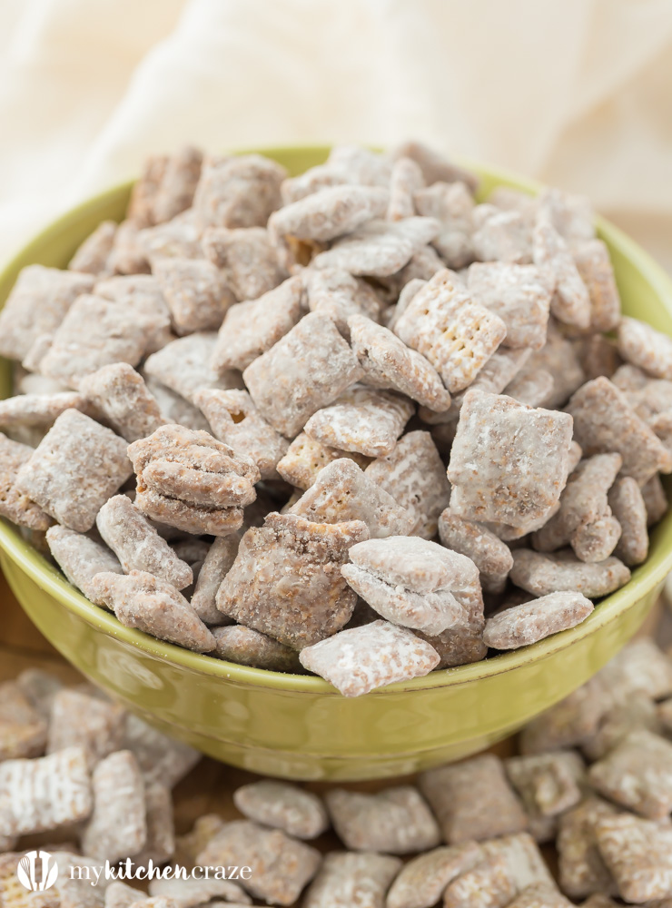 Muddy Buddies ~ crunchy cereal coated with chocolate, peanut butter and powered sugar. This is one kid approved snack and the best news is it takes minutes to throw together!