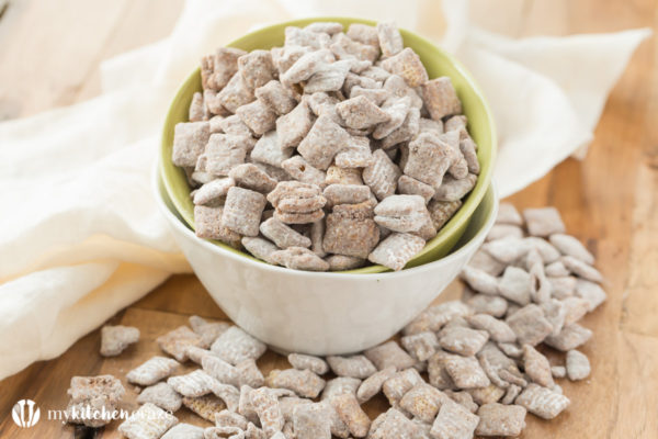 Muddy Buddies ~ crunchy cereal coated with chocolate, peanut butter and powered sugar. This is one kid approved snack and the best news is it takes minutes to throw together!