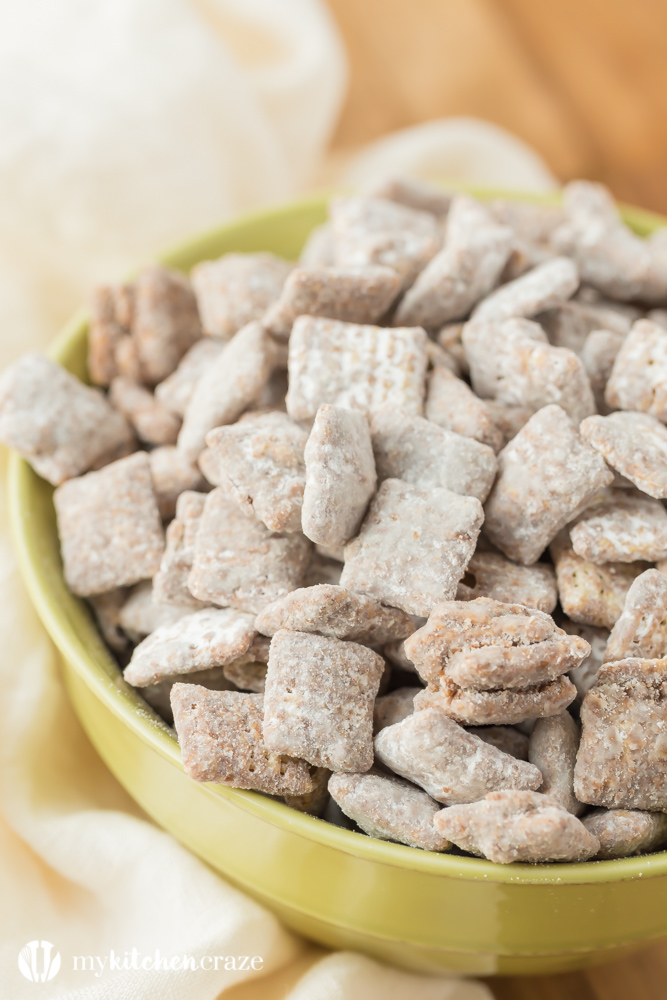 Muddy Buddies ~ crunchy cereal coated with chocolate, peanut butter and powered sugar. This is one kid approved snack and the best news is it takes minutes to throw together!