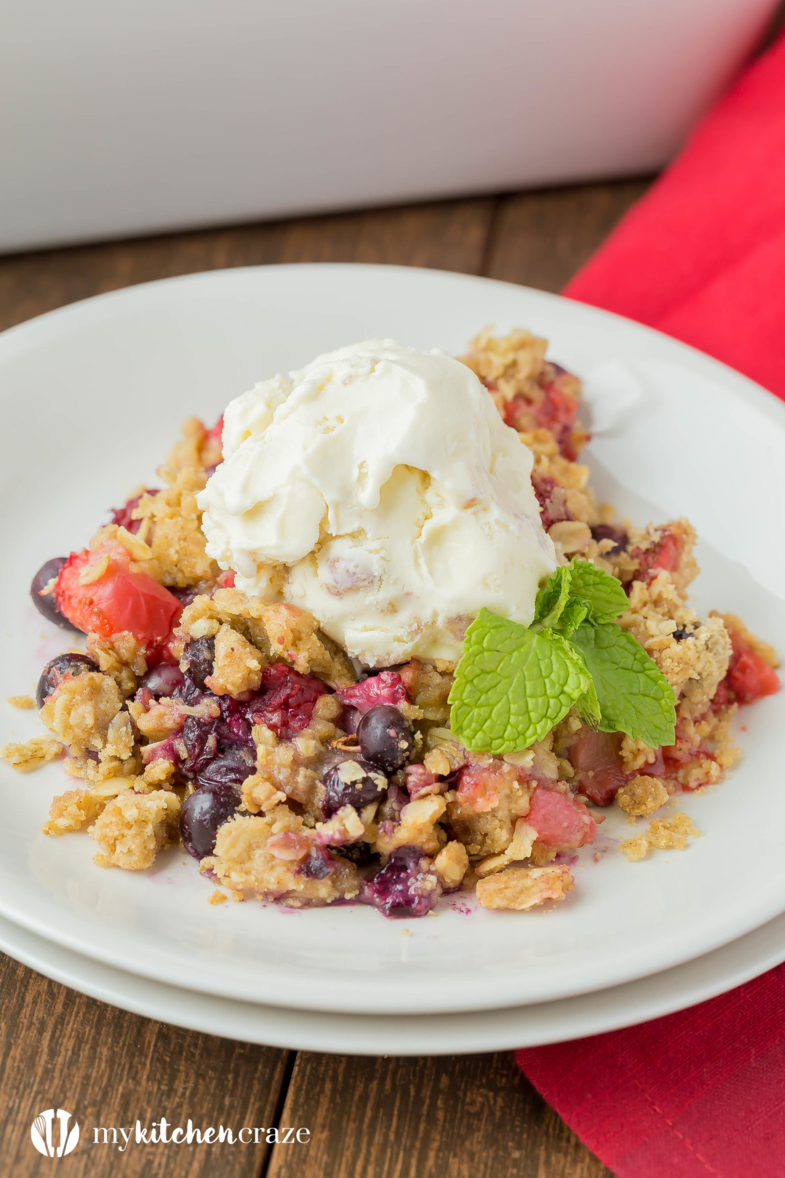 Warm mixed berries topped with crispy oats, make this Triple Berry Crisp a delicious fruit dessert! Serve it with a big scoop of vanilla ice cream or all by its self. It's delicious and a must have this season!