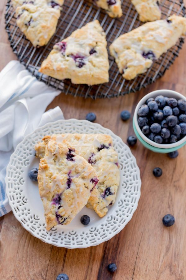 Blueberry Scones with Vanilla Glaze are perfect for a quick grab and go breakfast. They're crunchy around the edges but moist in the center. Topped with a vanilla glaze to give them a bit of sweetness.