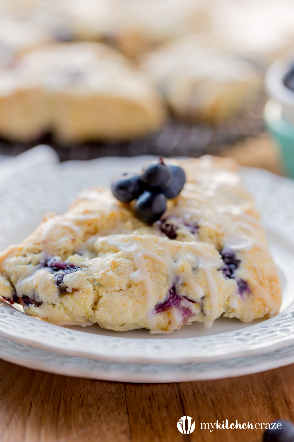 Blueberry Scones with Vanilla Glaze are perfect for a quick grab and go breakfast. They're crunchy around the edges but moist in the center. Topped with a vanilla glaze to give them a bit of sweetness.