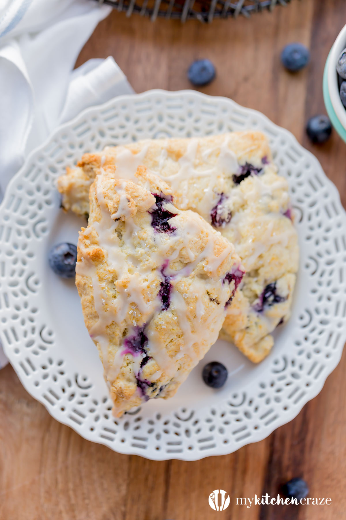 Blueberry Scones with Vanilla Glaze are perfect for a quick grab and go breakfast. They're crunchy around the edges but moist in the center. Topped with a vanilla glaze to give them a bit of sweetness.