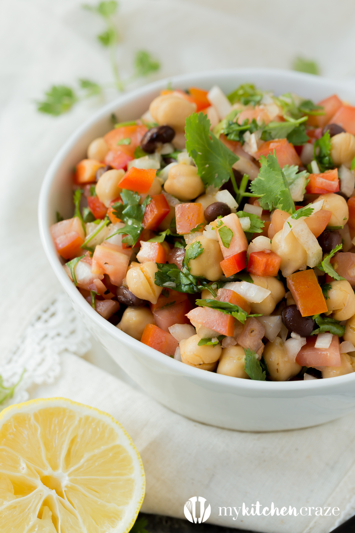 Simple, easy and fresh ingredients are the key to this delicious Tomato Chickpea Salad. You can use it as a side dish or eat it as the main with some protein. Either way, this salad is yummy.