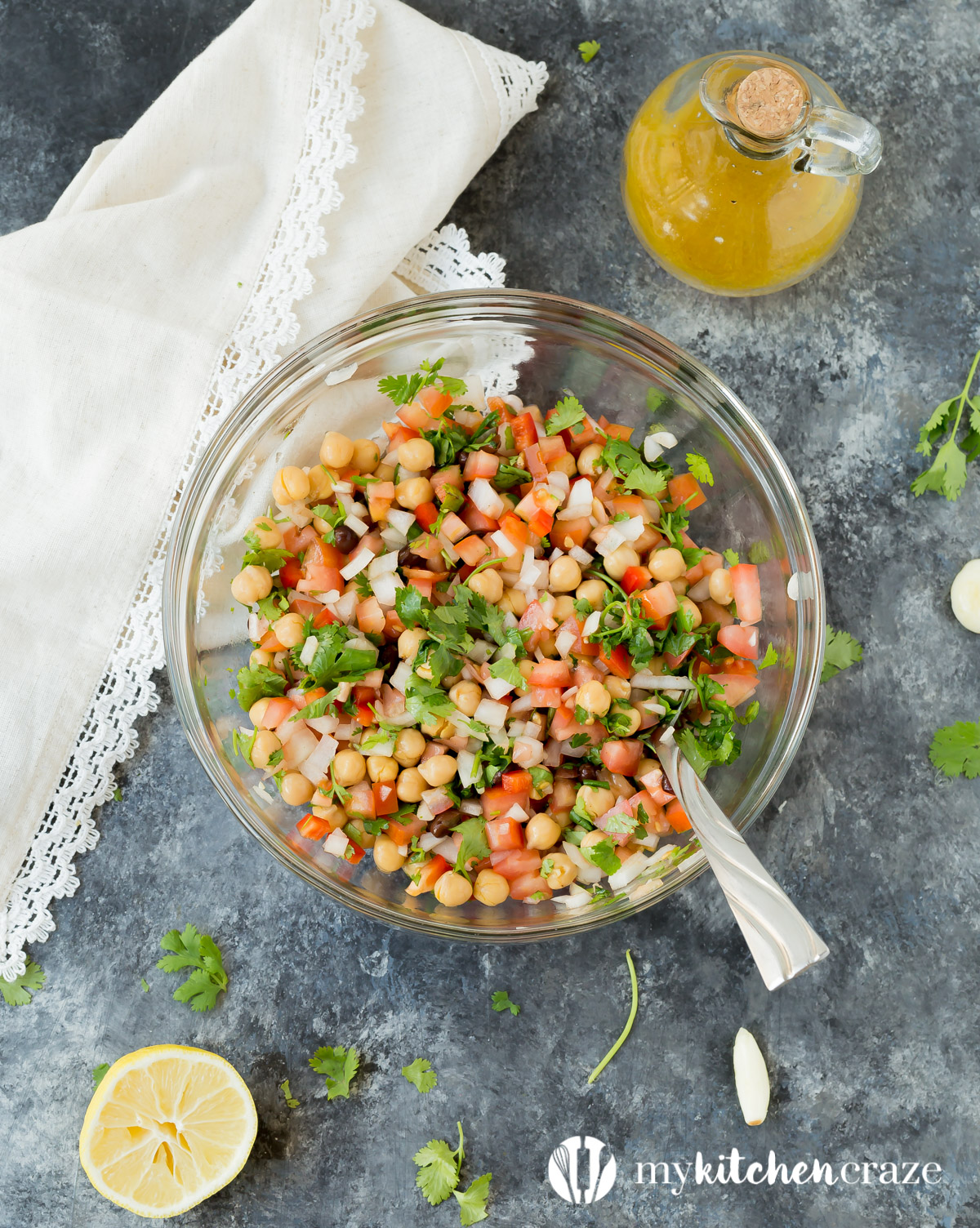 Simple, easy and fresh ingredients are the key to this delicious Tomato Chickpea Salad. You can use it as a side dish or eat it as the main with some protein. Either way, this salad is yummy.