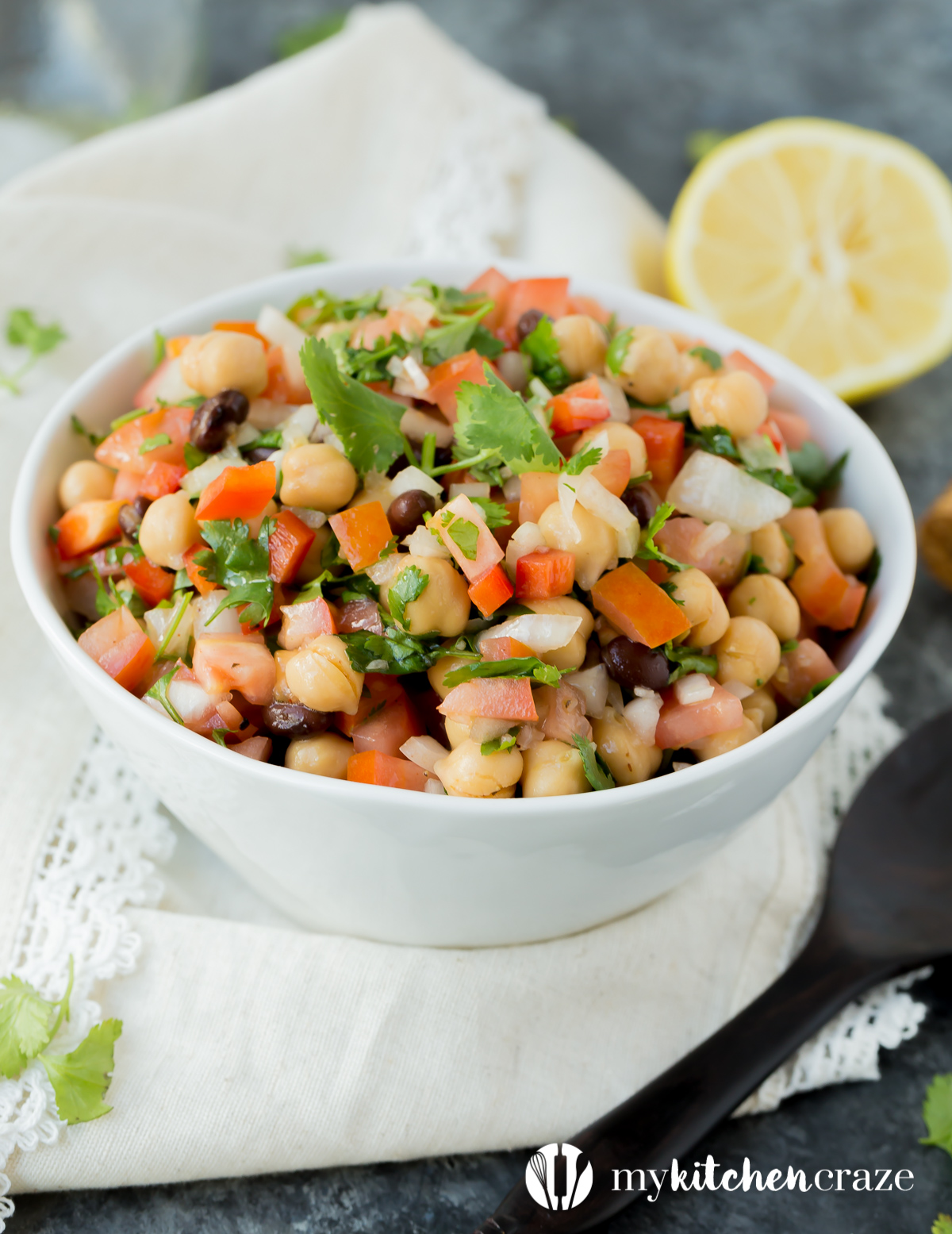 Simple, easy and fresh ingredients are the key to this delicious Tomato Chickpea Salad. You can use it as a side dish or eat it as the main with some protein. Either way, this salad is yummy.